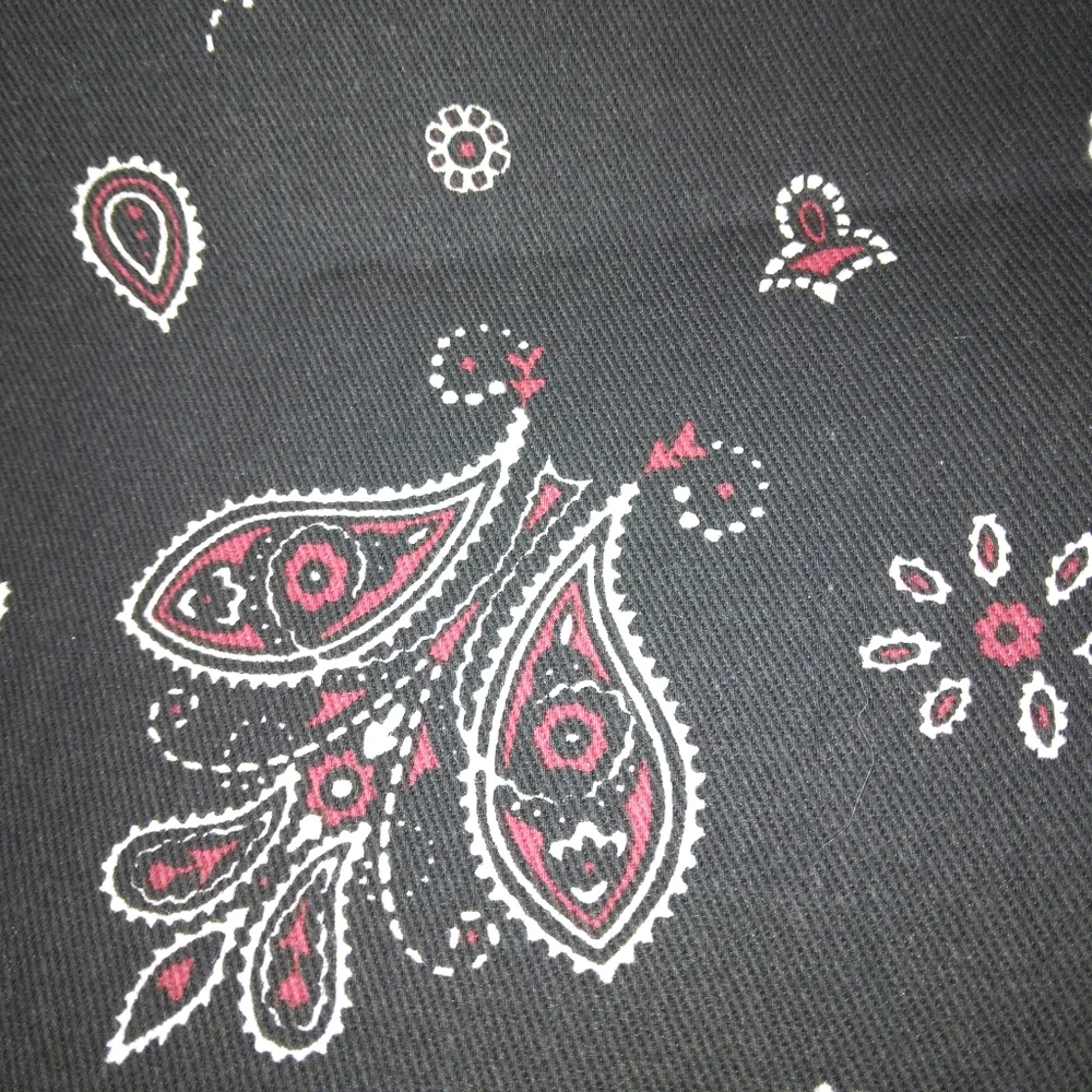FABRIC Red and white paisley print on black background, twill weave